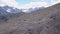 Top view of group of tourists vacationing on mountain route. Clip. Mountaineers line up along mountain rocky path on