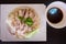 Top view of Hainanese chicken rice. Thai food gourmet steamed chicken with rice , khao mun kai in wood background