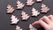 Top view of hand-laid gingerbread cookies Christmas trees on slate table