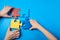 Top view hands of a autistic child and father arranging color puzzle symbol of awareness for autism spectrum disorder