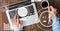 Top view of hands with laptop and coffee on tablet table