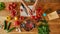 Top view of hands of man, cook holding, preparing tomatoes for cooking healthy meal with vegetables in the kitchen