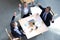 Top view of happy business people laugh near laptop in the office