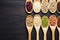 Top view harmony Beans and sesame collection on wooden spoons