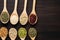 Top view harmony Beans and sesame collection on wooden spoons