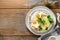 Top view healthy breakfast lunch mashed potatoes fried eggs broccoli tea wooden table