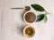 Top view of healthy soba tea and groats of tartary buckwheat  Ku Qiao seeds on light background. Flat lay. Copy space