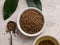 Top view of healthy soba tea and groats of tartary buckwheat  Ku Qiao seeds on light background. Flat lay. Copy space