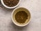 Top view of healthy soba tea and groats of tartary buckwheat  Ku Qiao seeds on light background. Flat lay. Copy space