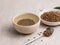 Top view of healthy soba tea and groats of tartary buckwheat  Ku Qiao seeds on light background. Flat lay. Copy space