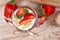 Top view of healthy strawberry fruit dessert with yogurt and puffed quinoa grains in jar surrounded by berries