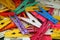 Top view of heap of colorful clothespins