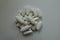 Top view of heap of magnesium citrate capsules, calcium citrate caplets and vitamin K2 tablets