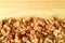 Top View of Heap of Walnut Kernels on the Wooden Table with Free Space for Text