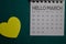 Top view Hello March text on a Calendar isolated on office desk