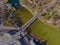 Top view of Heroes Square, lakes, Budapest city park. People are resting on the green grass. Lakes and bridge in the park. Spring