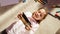 Top View Home: Happy Little Girl Using Smartphone While Lying on the Floor. Joyful Sunny Day and Clever Smiling Child Playing