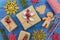 Top view of homemade christmas gifts and christmas decoration on blue wooden table