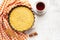 Top view of a homemade pumpkin pie on grey background