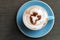 Top view of hot cocoa latte with heart shaped frothed milk in ce
