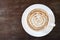 Top view of hot coffee caramel macchiato cappuccino cup on old w