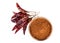 Top view of hot pepper pods and a wooden bowl full of ground red pepper on a white background.