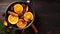 Top view of hot wine with aromatic spices on a dark background