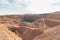 Top view of a huge crater in an old copper quarry full of water, in the hidden lake in Timna Park