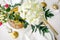 Top view of hydrangea flower, elegance classic table setting with white dishes, gold cutlery
