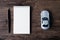 Top view image of blank page notebook ,pen and small car model o