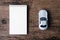 Top view image of blank page notebook and small car model on the