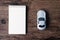 Top view image of blank page notebook and small car model on the