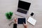 Top view image of businesswoman point at the tablet screen  on the wooden desk with other office gadgets