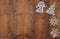 Top view image of christmas festive decorations on wooden background. Flat lay.