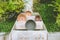 Top view image of empty flower clay pot on wooden shelf at outdoor garden.