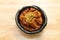 Top view image of Korean food, Braised Short Ribs Galbi Jjim, on a bowl and wooden table