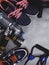 Top view image of sport shoes, dumbbells, press roll, water, expander. Fitness or workout equipment. Weight loss and sports