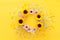 Top view image of sunflowers over yellow wooden background