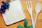 Top view image of wooden spoon, fork and blank tray placed on wooden table, Different wooden kitchen tools with copy