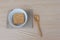 Top view Instant noodles in white dish spoon and chopsticks on wood background.