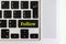 Top view isolated laptop keyboard with yellow `follow` text on button, concept design f