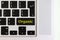 Top view isolated laptop keyboard with yellow `organic` text on button, concept design f