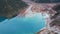 Top view of the Issyk mountain lake and the dam.