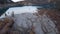 Top view of the Issyk mountain lake and the dam.