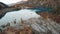 Top view of the Issyk mountain lake and the dam.