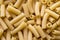 Top view of Italian uncooked tortiglioni pasta