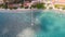 Top view jetty with janggolan boat on turquoise coastline