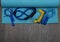 Top view on jump ropes, rubber fitness bands on blue fitness mat