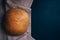 Top view of the just homebaked bread on the cool stone table.