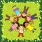 Top view of kids lying on the grass in a circle